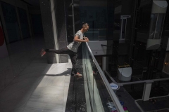 NPDL05JUL2822. An Iranian athletes warms up himself before participating in a Parkour Speed Run competition in a shopping mall which is currently under constructions in northwestern Tehran on July 28, 2022.