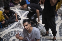 NPDL21JUL2822. An Iranian athlete reacts as he watches a Parkour Speed Run competition in a shopping mall which is currently under constructions in northwestern Tehran on July 28, 2022.