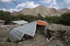 NPNW14JUL3122. A view of a building which is destroyed and covered with mud caused of flash flooding in the flooded village of Mazdaran in Firoozkooh county 124 km (77 miles) northeast of Tehran, July 31, 2022.