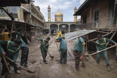 NPNW15JUL2922. Workers clear mud at Imamzadeh Davood holy shrine after flash floods in the northwestern part of Tehran on July 29, 2022.