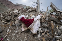 NPNW22AUG0122. A red blanket is pictured on the ruins of a building which is destroyed by flash flooding in the village of Mazdaran in Firoozkooh county 124 km (77 miles) northeast of Tehran, August 1, 2022.