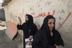 NPNW28AUG0322. Two veiled Iranian women who have lost their relatives in a sudden-flooding mourn as they arrive the flooded village of Mazdaran in Firoozkooh county 124 km (77 miles) northeast of Tehran to attend a funeral for the flood victims, August 3, 2022.