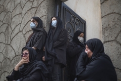 NPNW35AUG0322. Veiled Iranian women who have lost their relatives in a sudden-flooding in the flooded village of Mazdaran in Firoozkooh county 124 km (77 miles) northeast of Tehran mourn during a funeral for flood victims, August 3, 2022.