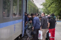 NPNW45AUG0222. Iranian villagers take in a train as they at a train station in the flooded village of Mazdaran in Firoozkooh county 124 km (77 miles) northeast of Tehran, while leaving the flooded area to a safer place, four days after flash flooding, August 2, 2022.